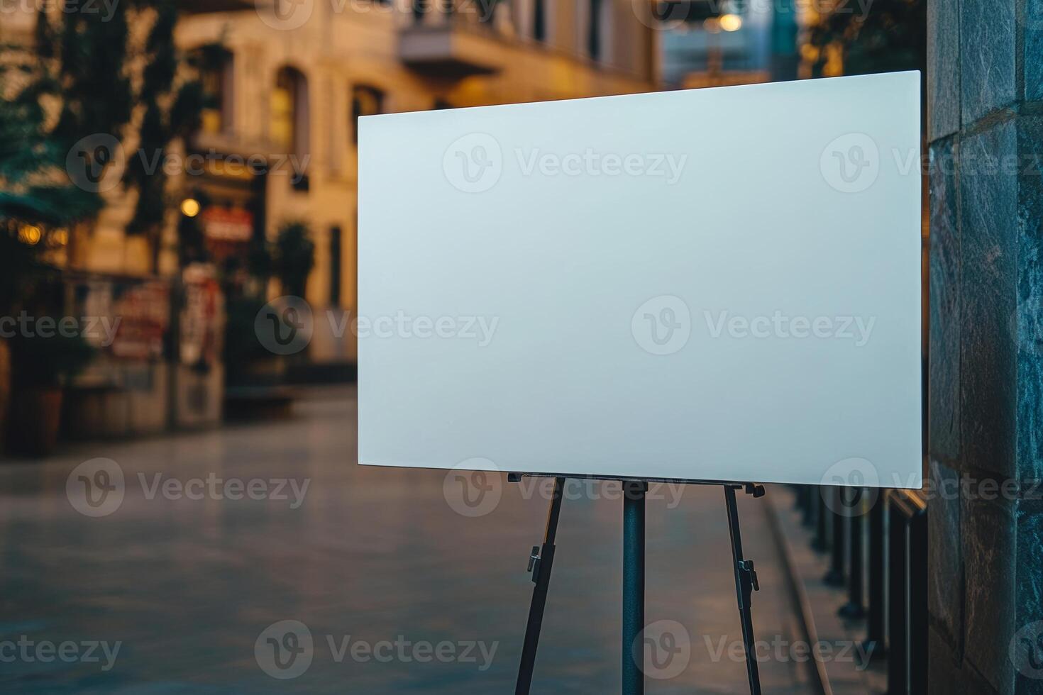 Minimalist gallery display featuring a large blank canvas on a metal stand in a softly lit exhibition space photo