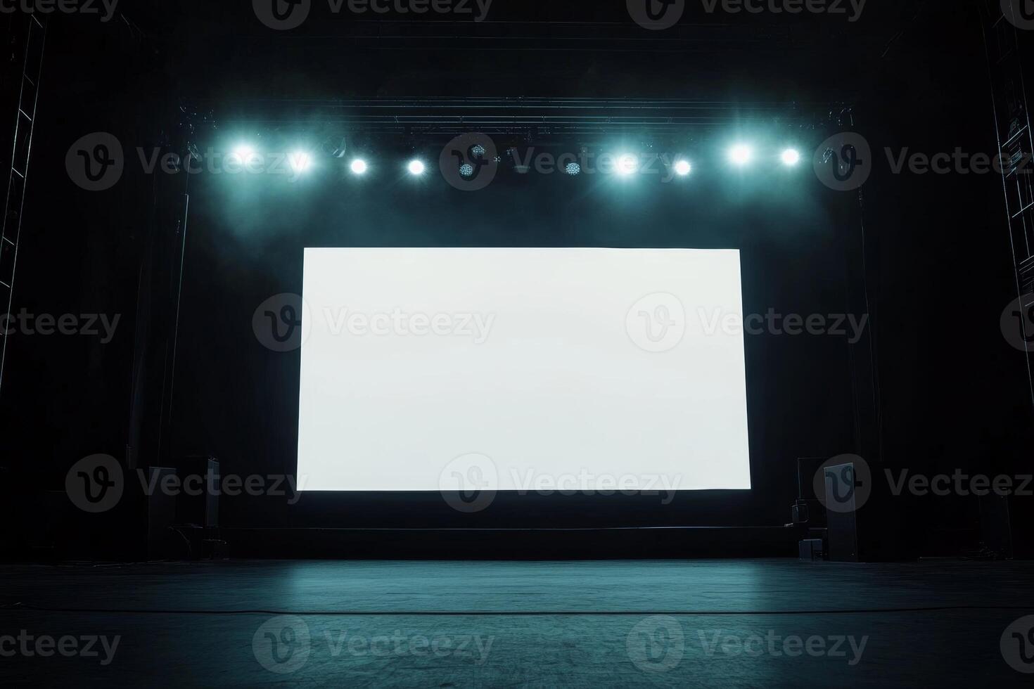 Blank screen on stage illuminated by bright lights in a concert hall setting, ideal for event promotion or announcements photo