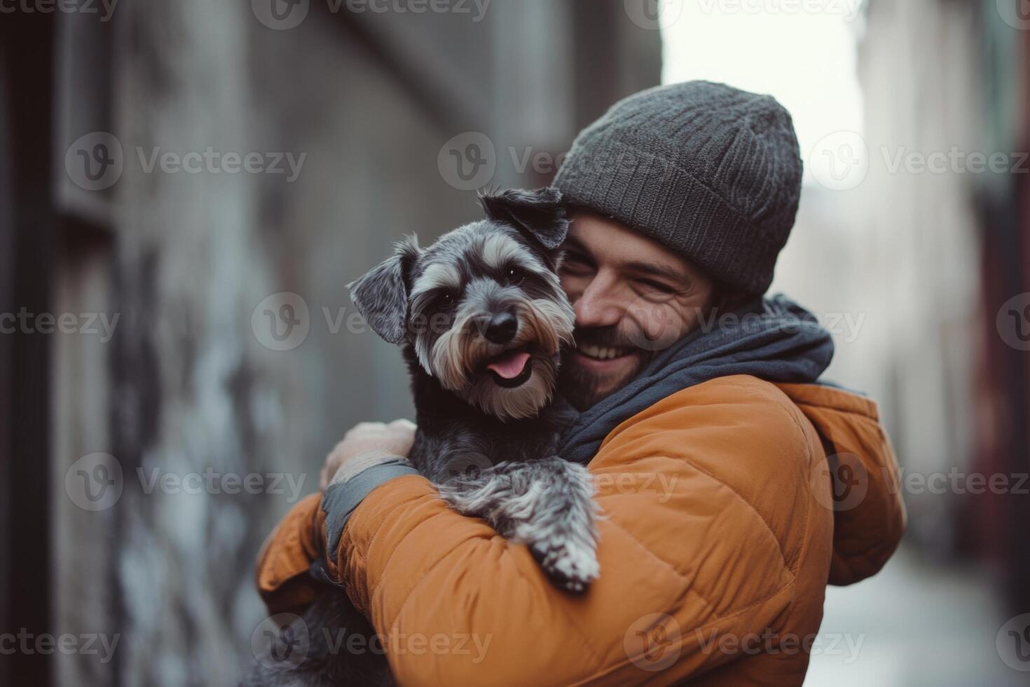 A man joyfully embraces a smiling schnauzer in a cozy urban setting under soft daylight photo