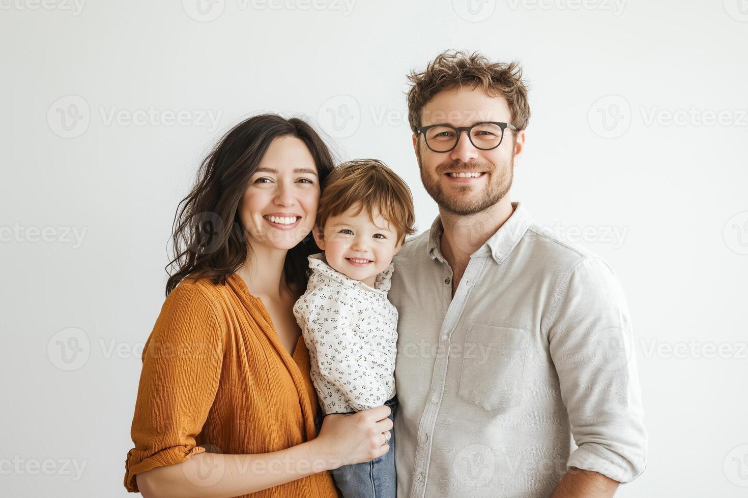 Happy family portrait of a mother, father, and child with bright smiles in a minimalistic setting photo