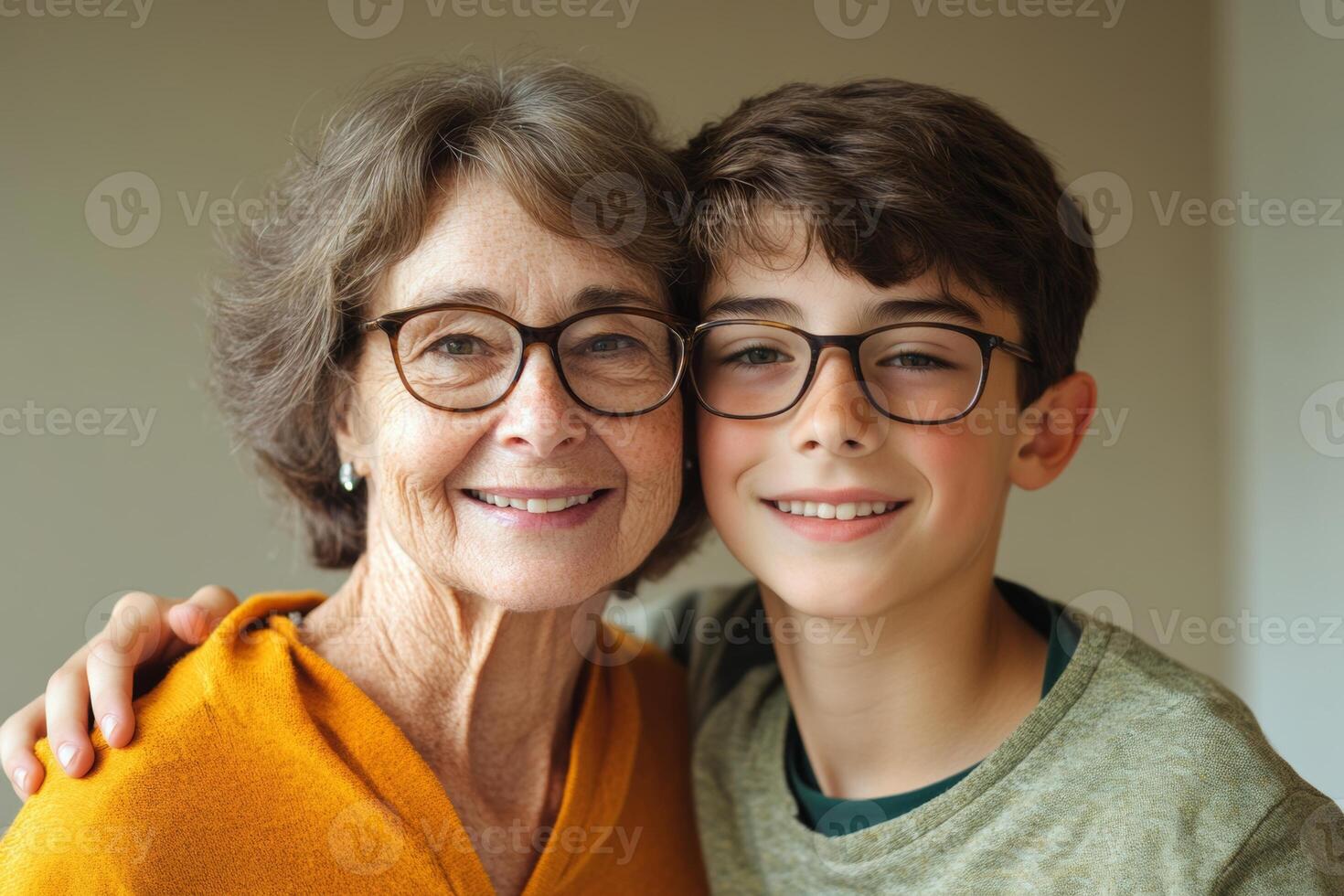 Happy retired mom and her cheerful son share a loving hug indoors, smiling proudly for the camera in a warm and cozy atmosphere photo