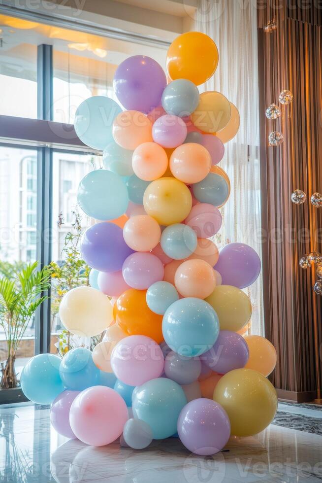 A vibrant arrangement of colorful pastel balloons perfect for celebrations and events in a modern indoor venue photo