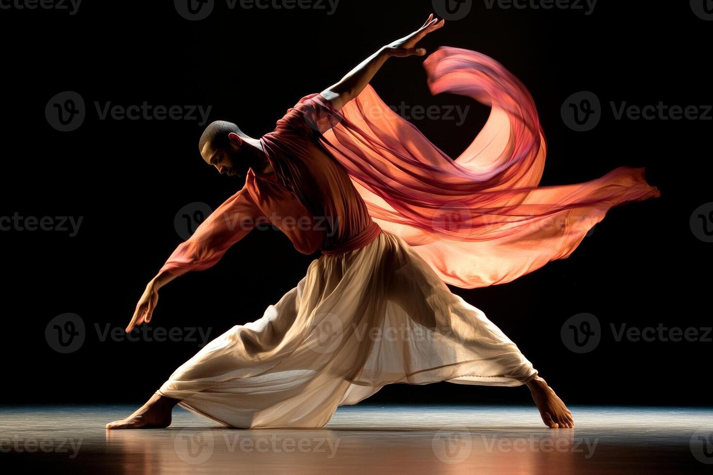 Contemporary dancer gracefully expressing movement in an artistic performance with flowing outfit and dramatic lighting photo