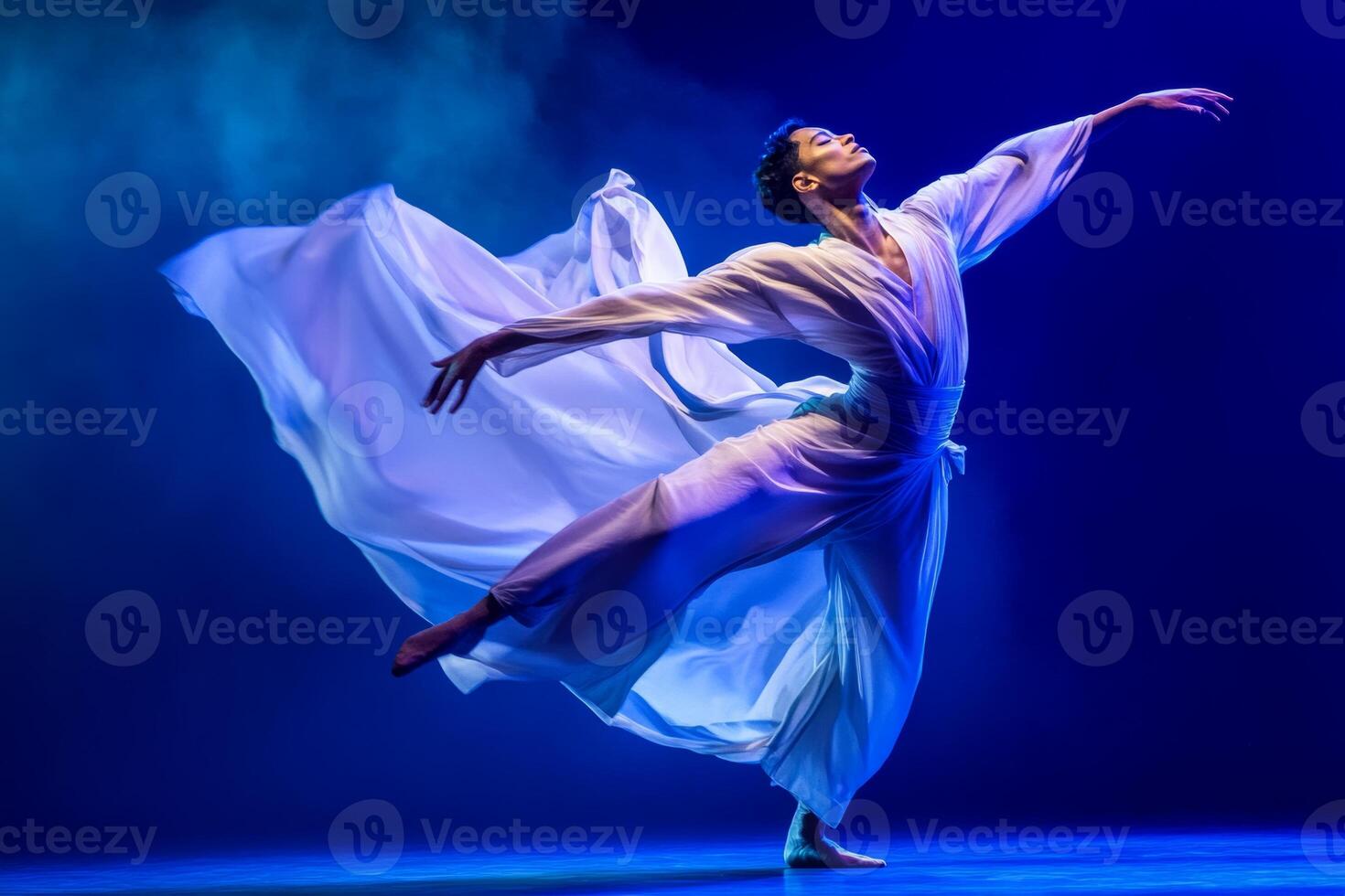 Contemporary dancer in mid-motion wearing a flowing outfit, captured with blurred effect and dramatic lighting on stage photo