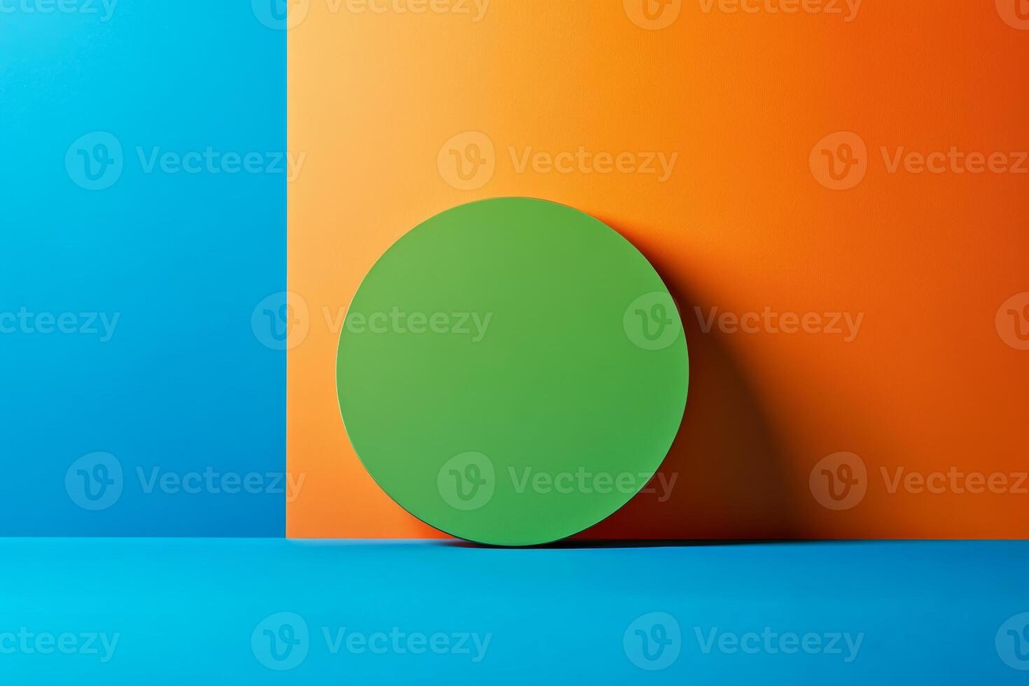 Minimalist green circle balanced on vibrant blue and orange split background showcasing clean lines and bold colors in a modern design aesthetic photo