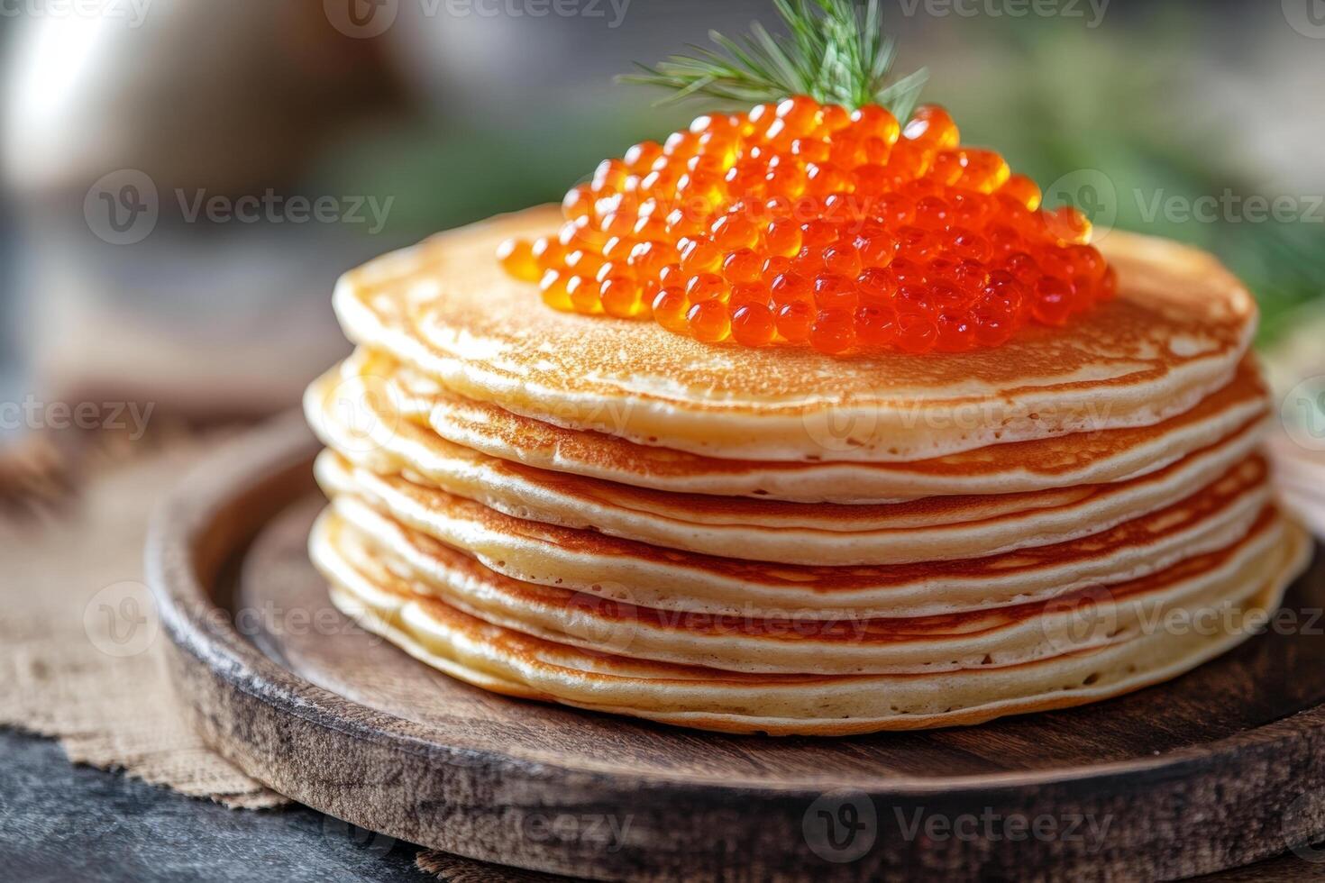 Delicious stack of pancakes topped with rich salmon roe on a rustic wooden plate for a hearty breakfast photo