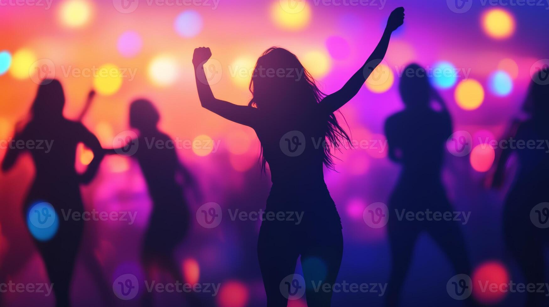 People joyfully dancing at an outdoor concert party during a vibrant summer night celebration photo