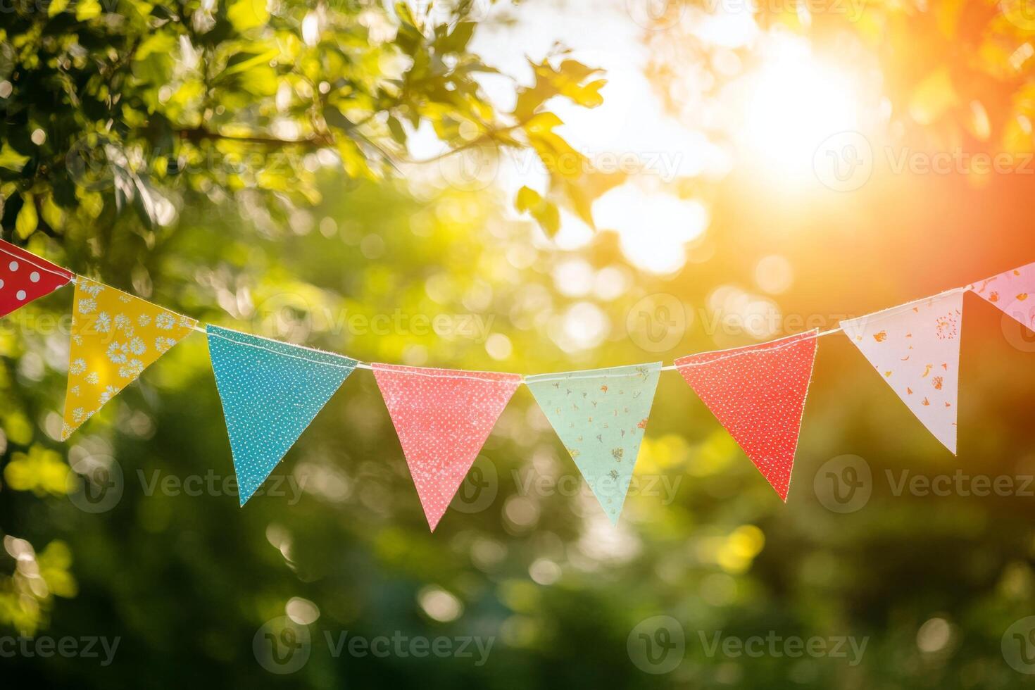 Colorful flags create a festive atmosphere at an outdoor celebration during a sunny afternoon, enhancing the joyful spirit of the event photo
