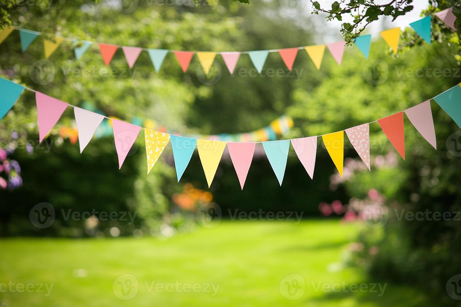 Colorful flags hanging in a vibrant garden during a summer celebration event with friends and family enjoying the festive atmosphere photo