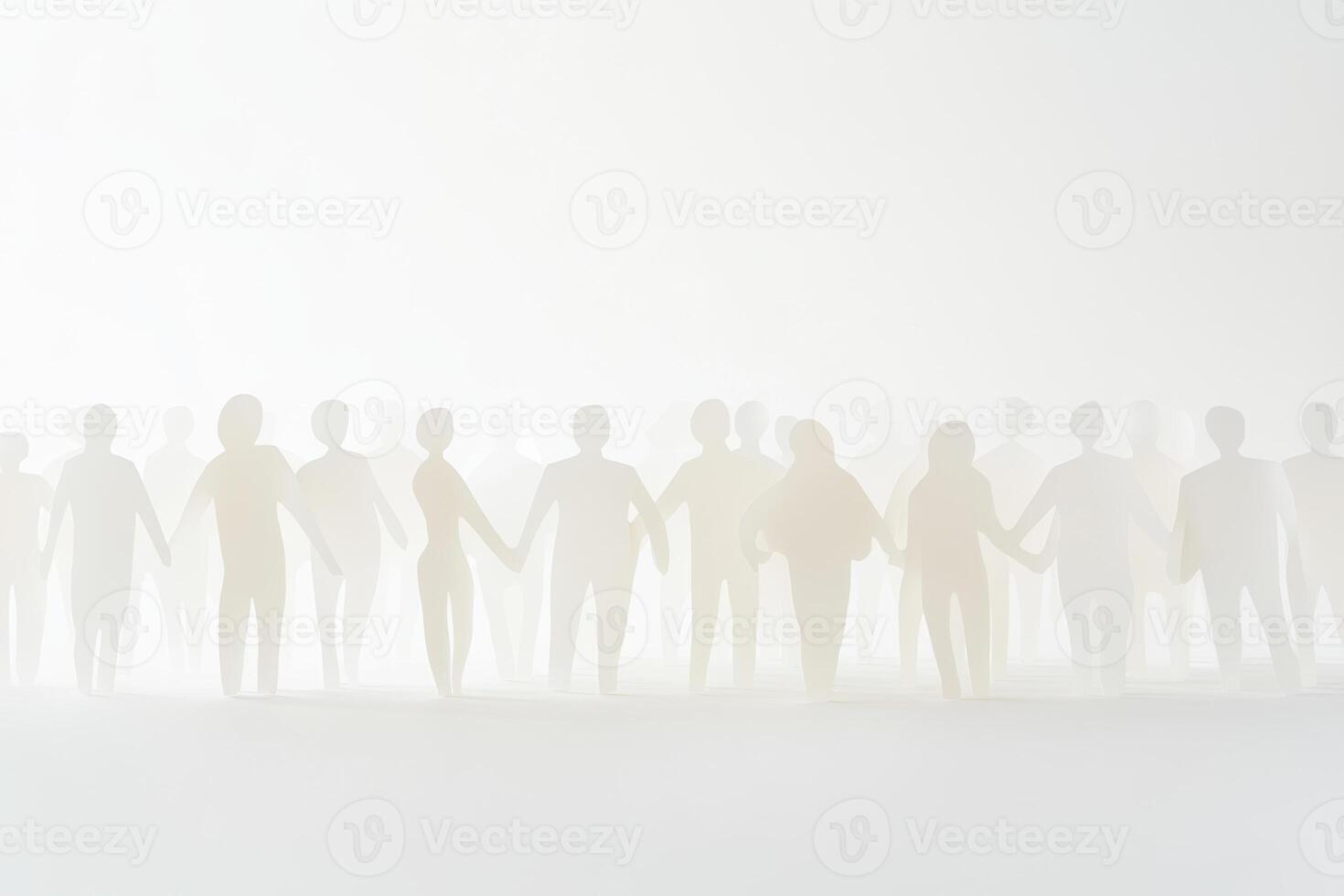 People holding hands together in a misty environment during a community gathering at sunset photo