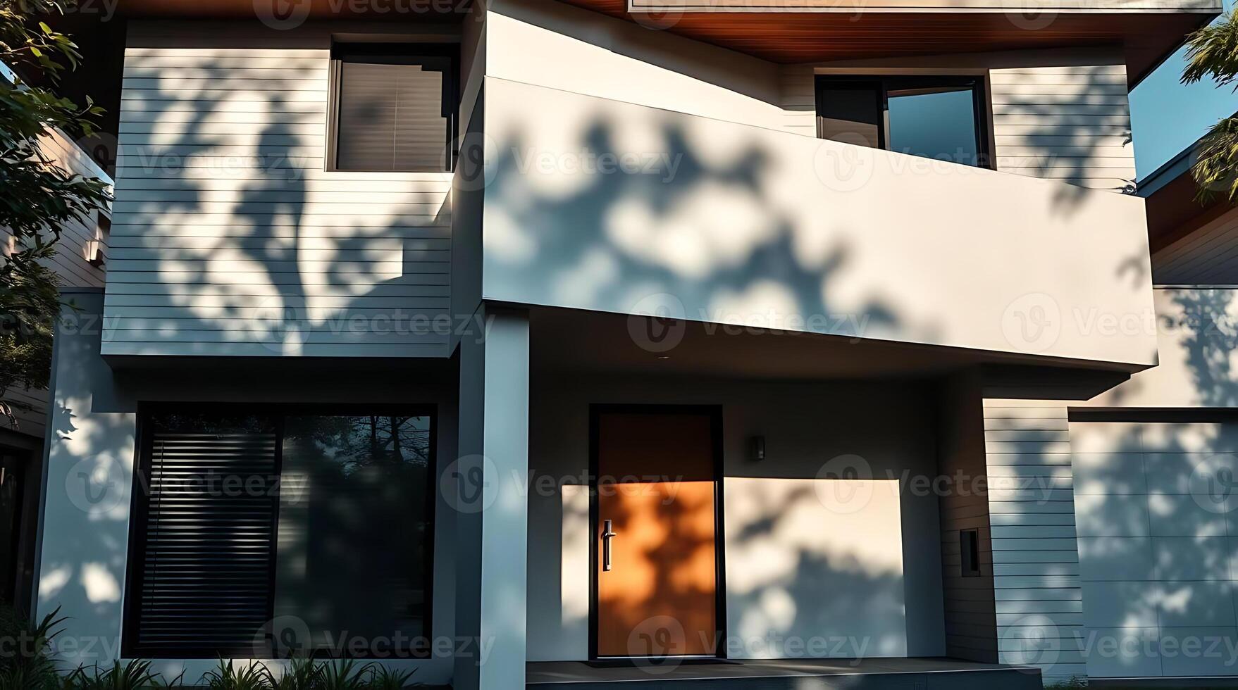 Modern home exterior facade with striking shadows and contemporary design photo