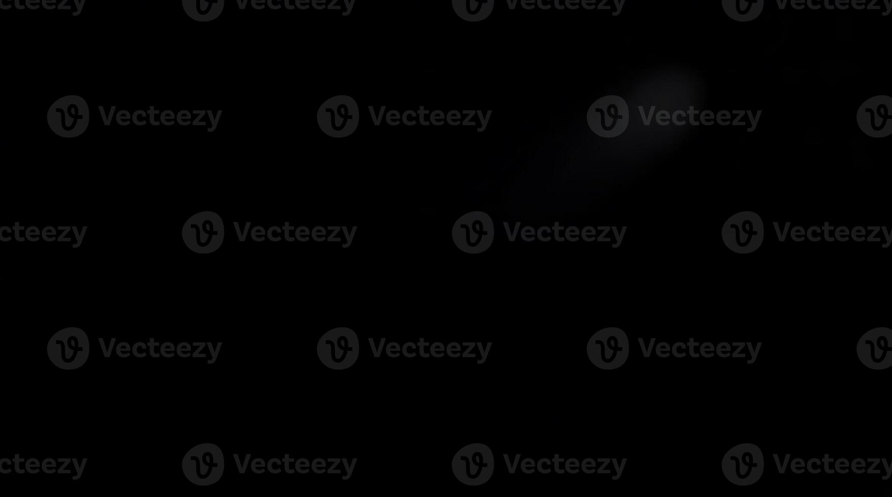 A dark abstract background with a subtle blurred light effect creating a mysterious mood photo