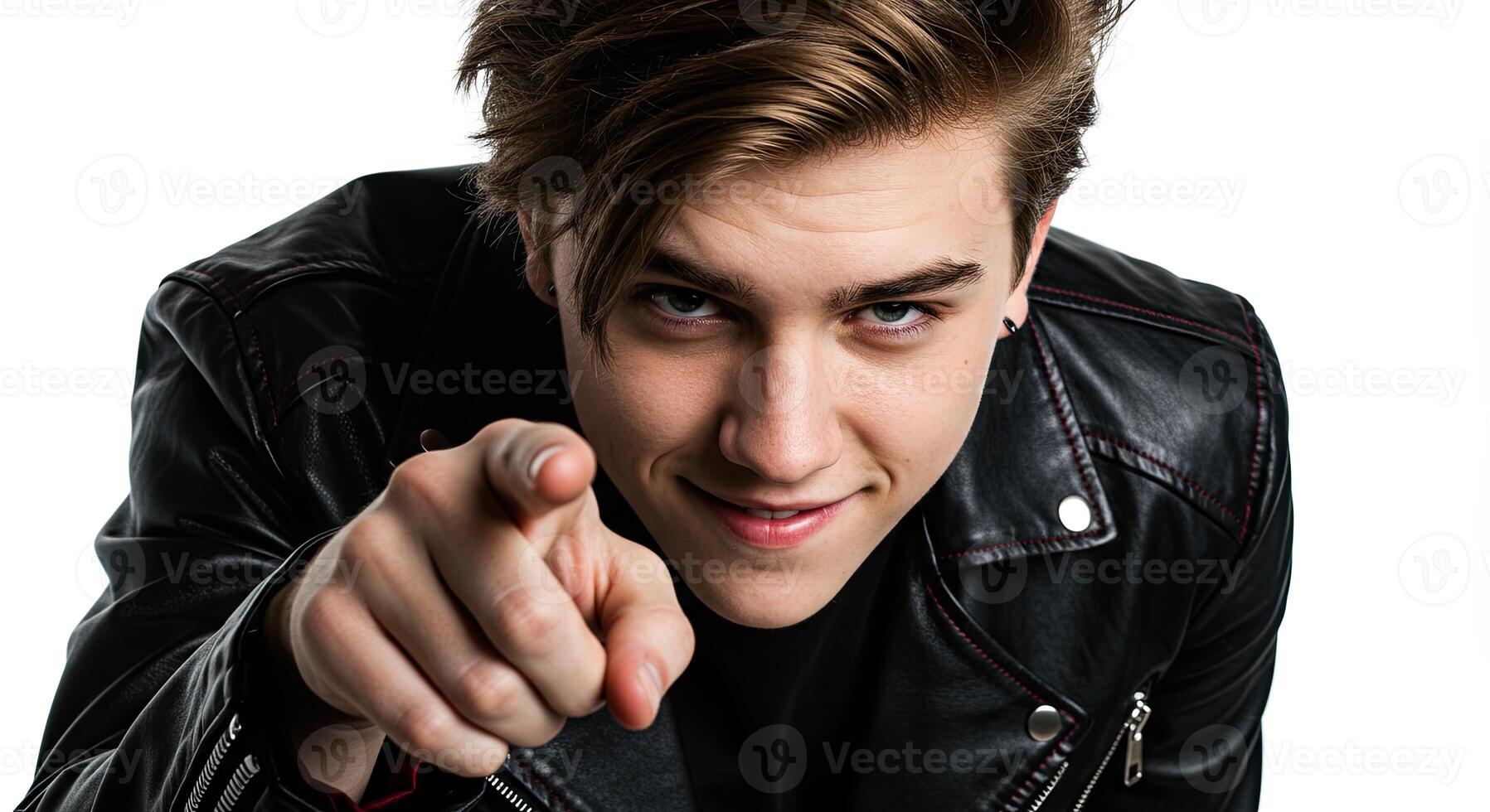 Young man points directly at the viewer with a confident expression photo