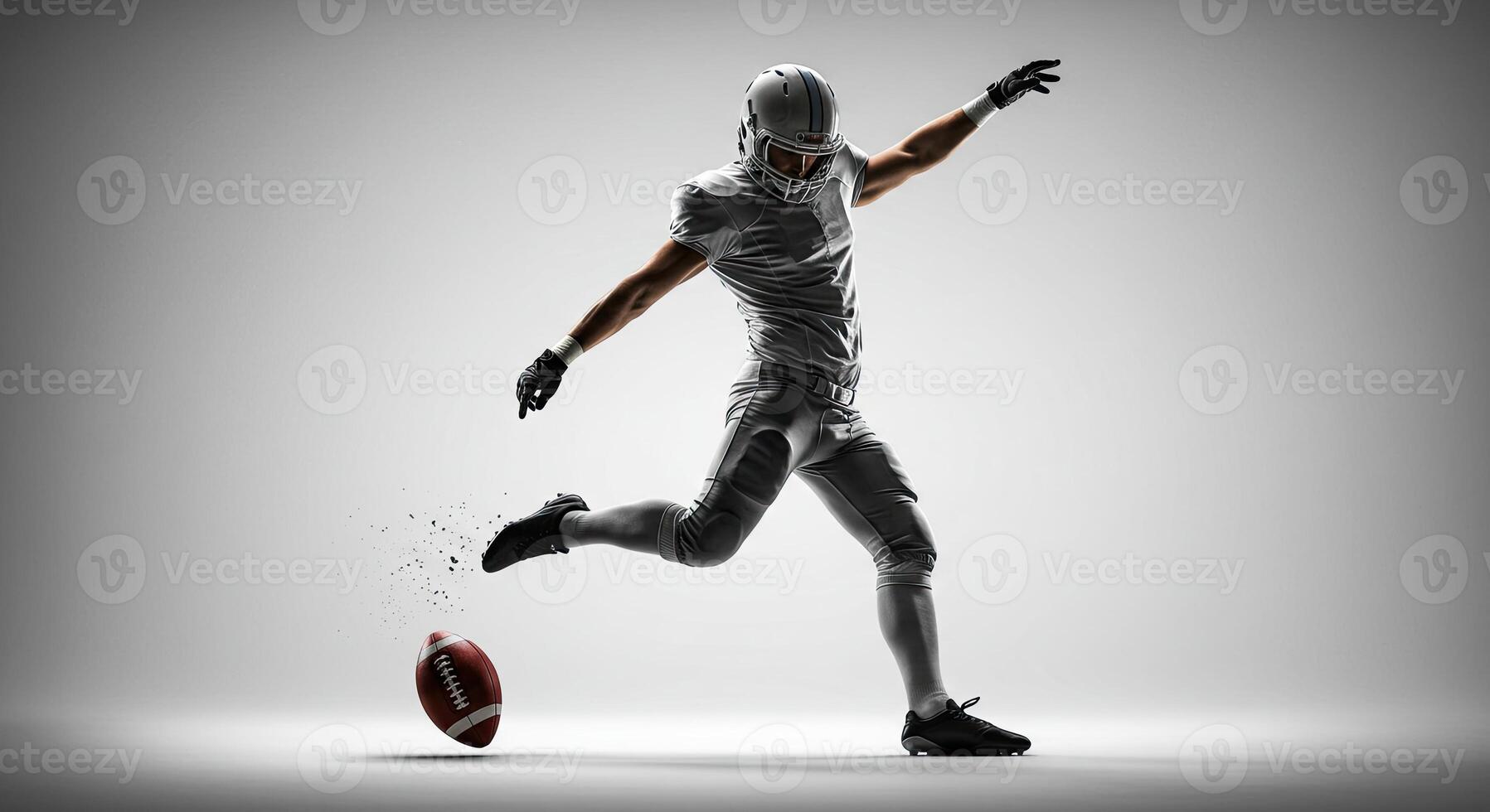 Football player kicking the ball in a dynamic action shot against a bright backdrop photo