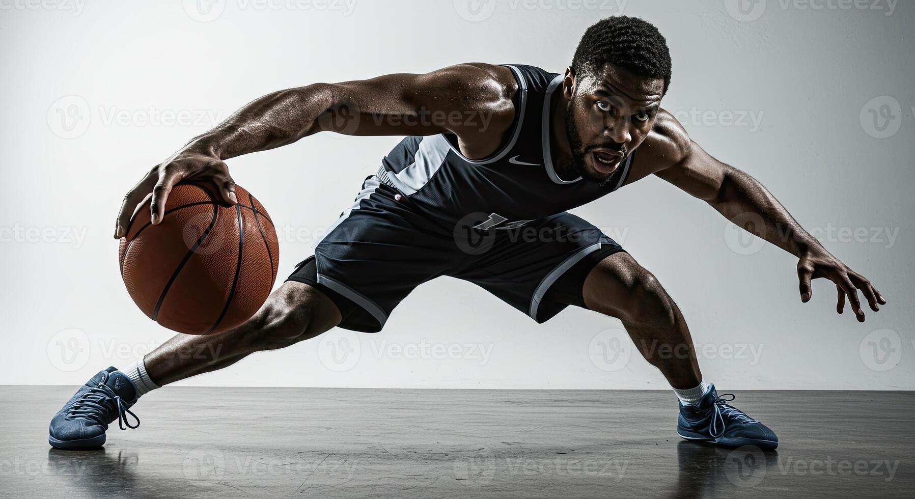 Intense African American basketball player dribbling ball in dynamic pose photo