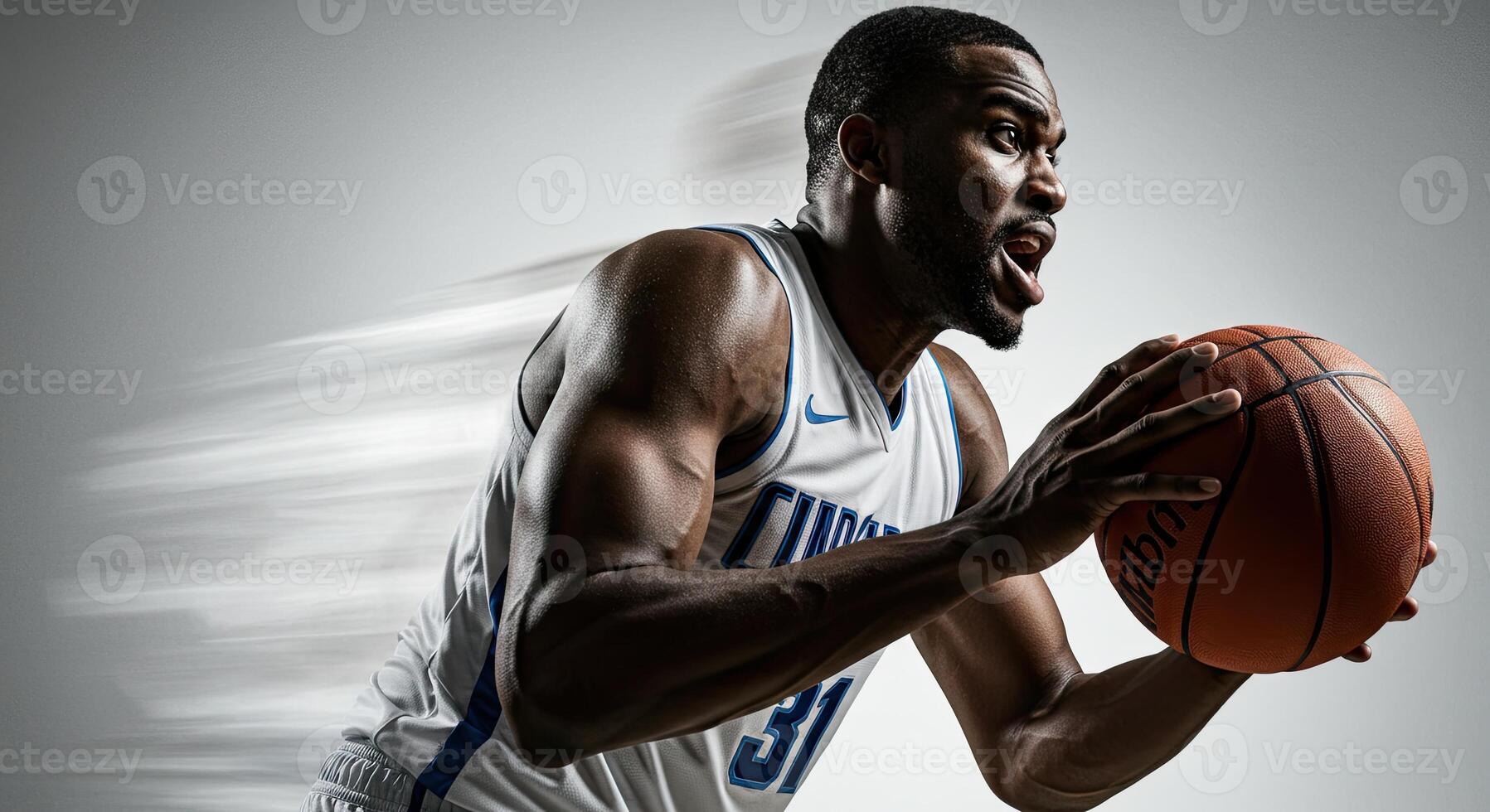 Intense African American basketball player driving to the hoop with ball photo