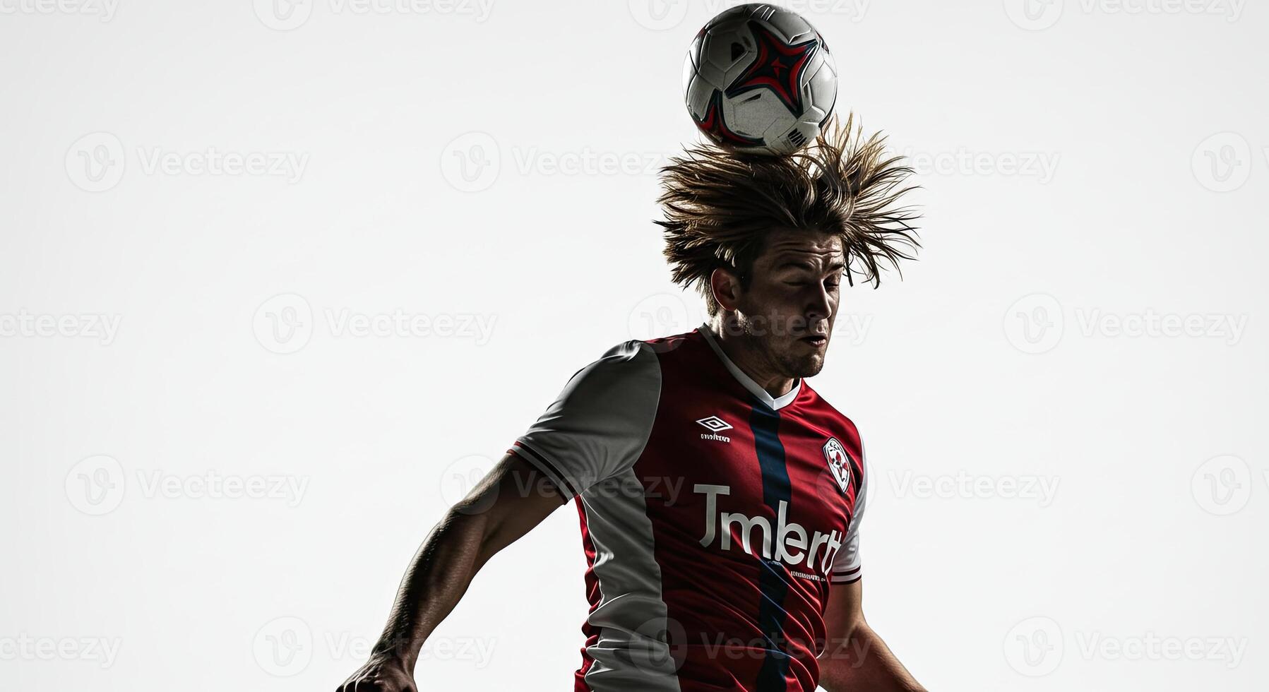 Soccer player heading the ball in action against a bright white background photo
