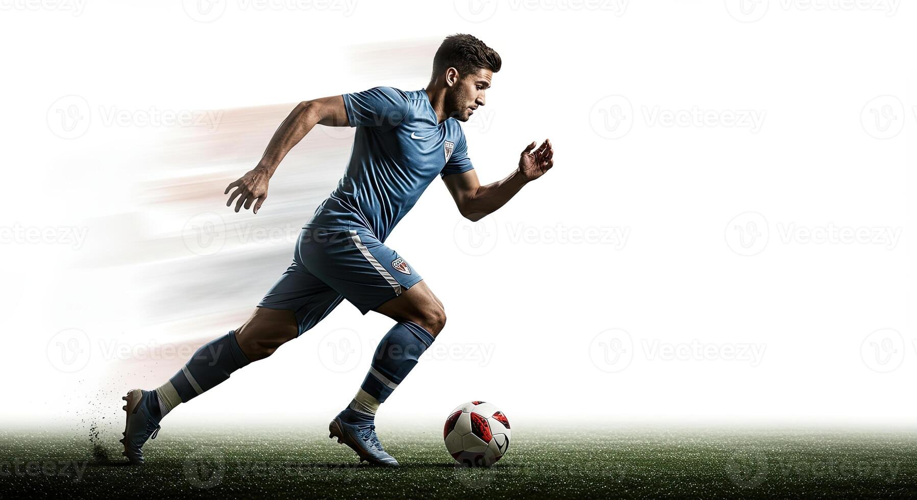 Soccer player in action running fast with the ball on a green field. photo