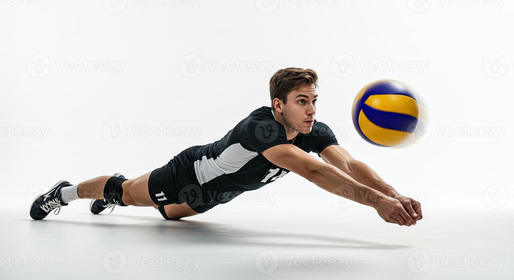 Volleyball player diving to save the ball with determination and focus on white background. photo