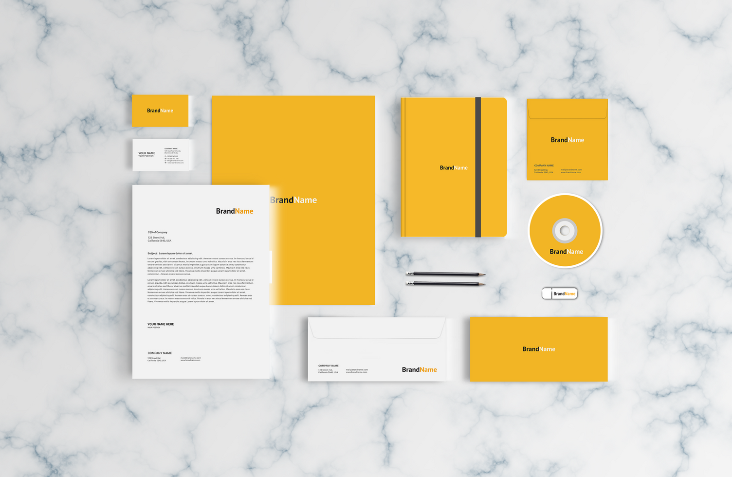 Stationary Mockup with Notepad and CD Cover Yellow Color psd