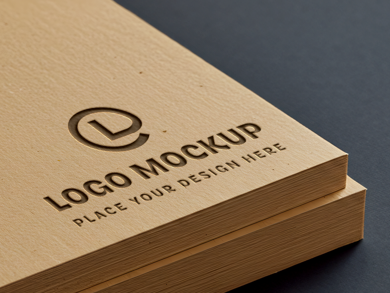 Embossed Logo Mockup on Textured Beige Cardboard Stack psd