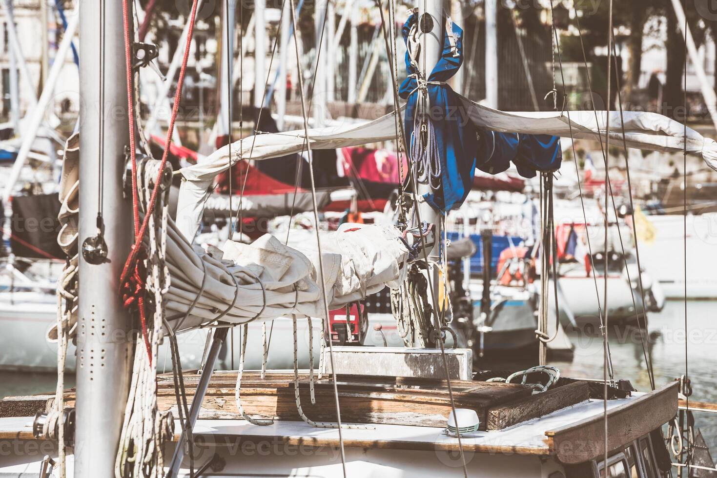 Sailboats in harbor with coiled ropes and nautical details, background photo