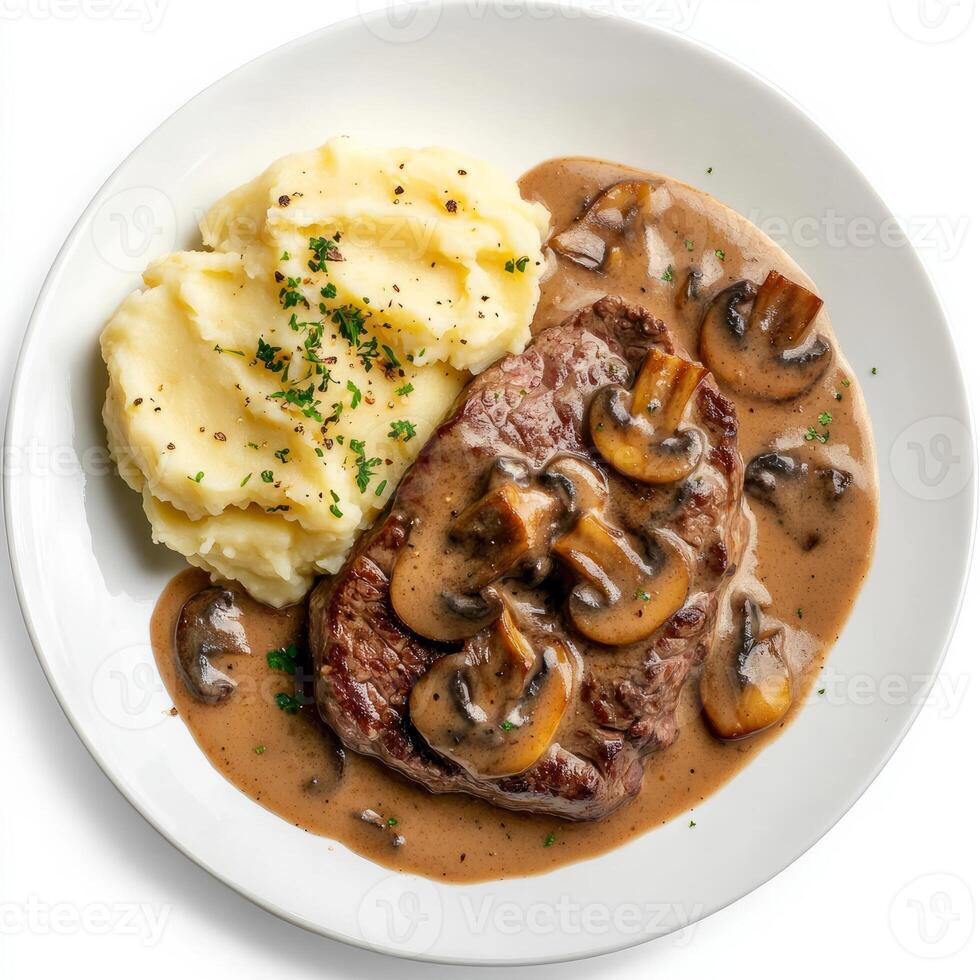 A well crafted shot of a plate of steak Diane, featuring a pan-seared steak in a creamy brandy-mushroom sauce, served with mashed photo