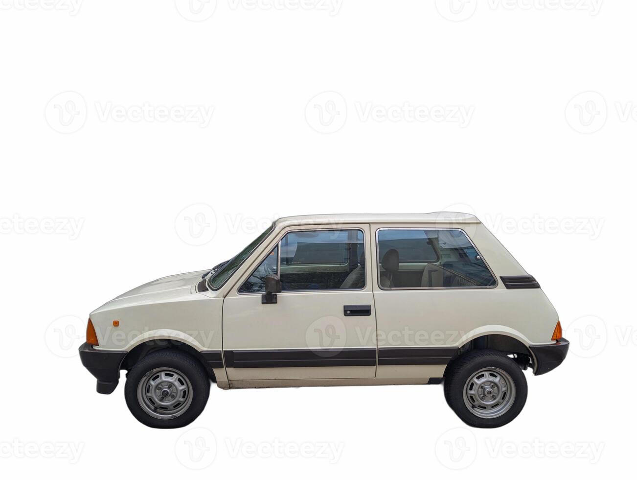 Classic white compact car parked against a plain background showcasing its distinctive design and features photo