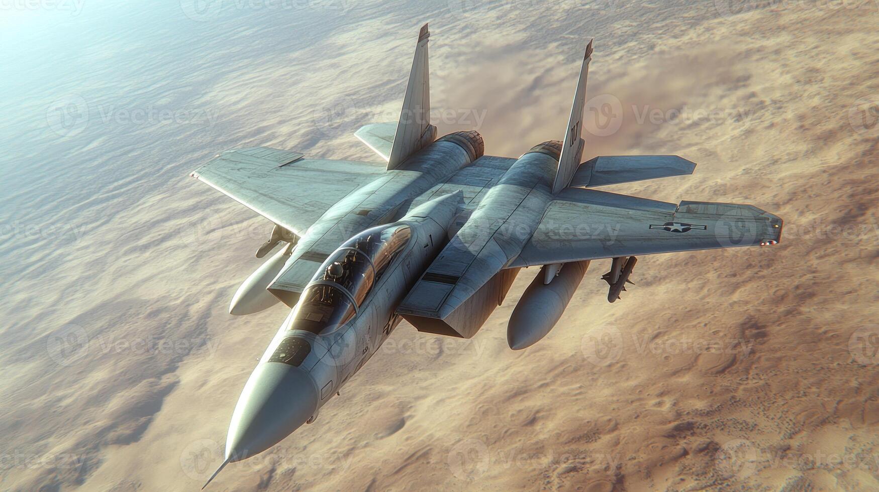 A military aircraft glides gracefully over arid terrain under a soft sunset glow photo