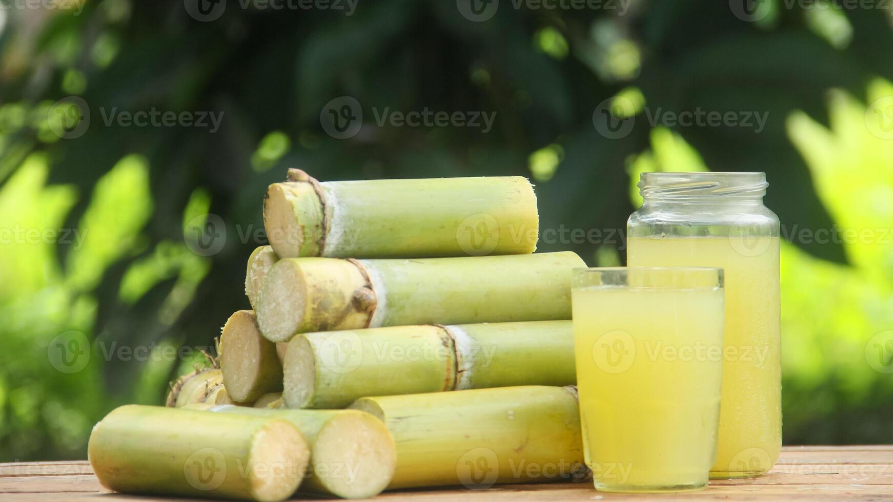 Drink from sugar cane juice, squeezed sugar cane juice with sugar cane stalks photo