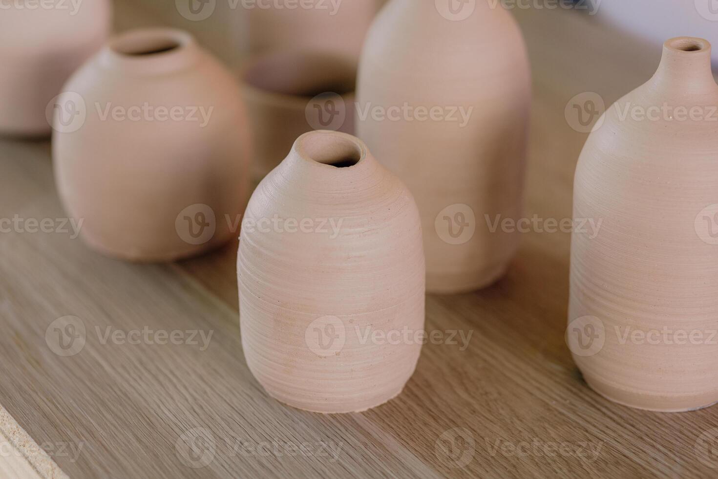 A group of vases sitting on a table photo