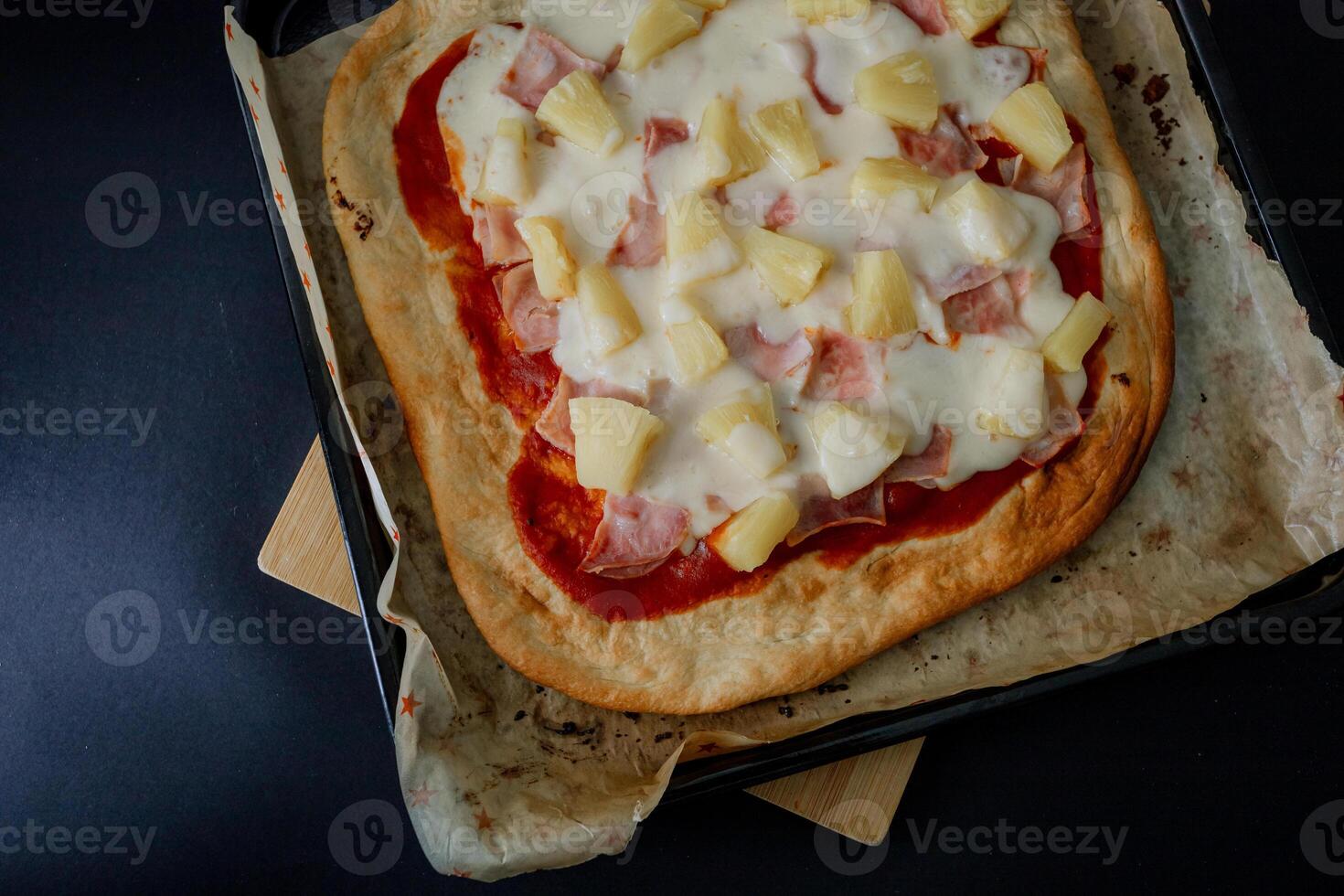 a pizza on a baking sheet photo
