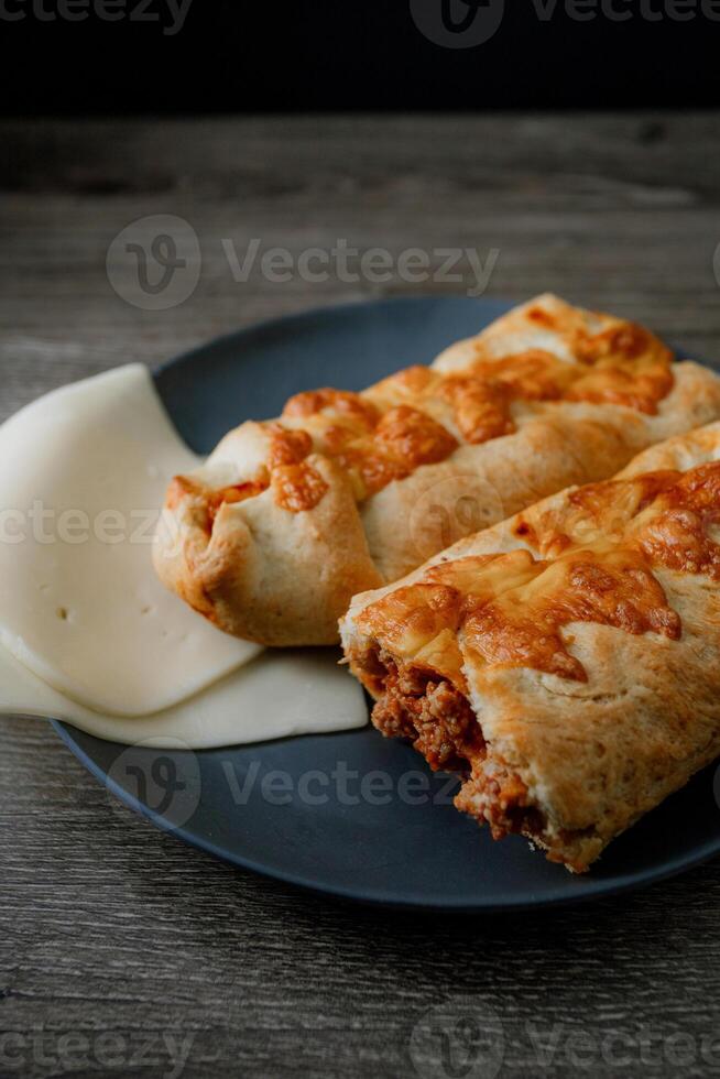a plate with two pastries on it photo