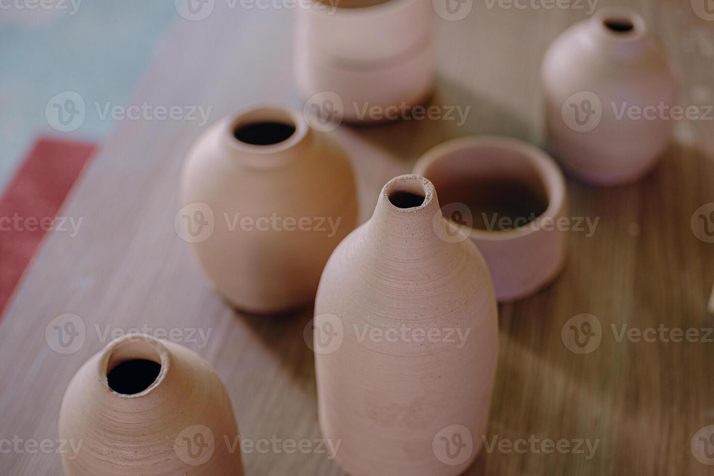 A table with several vases on it photo