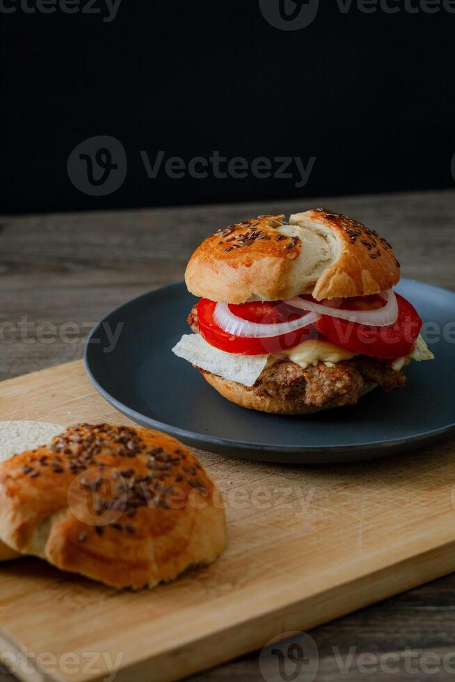 a beef burger on a plate photo