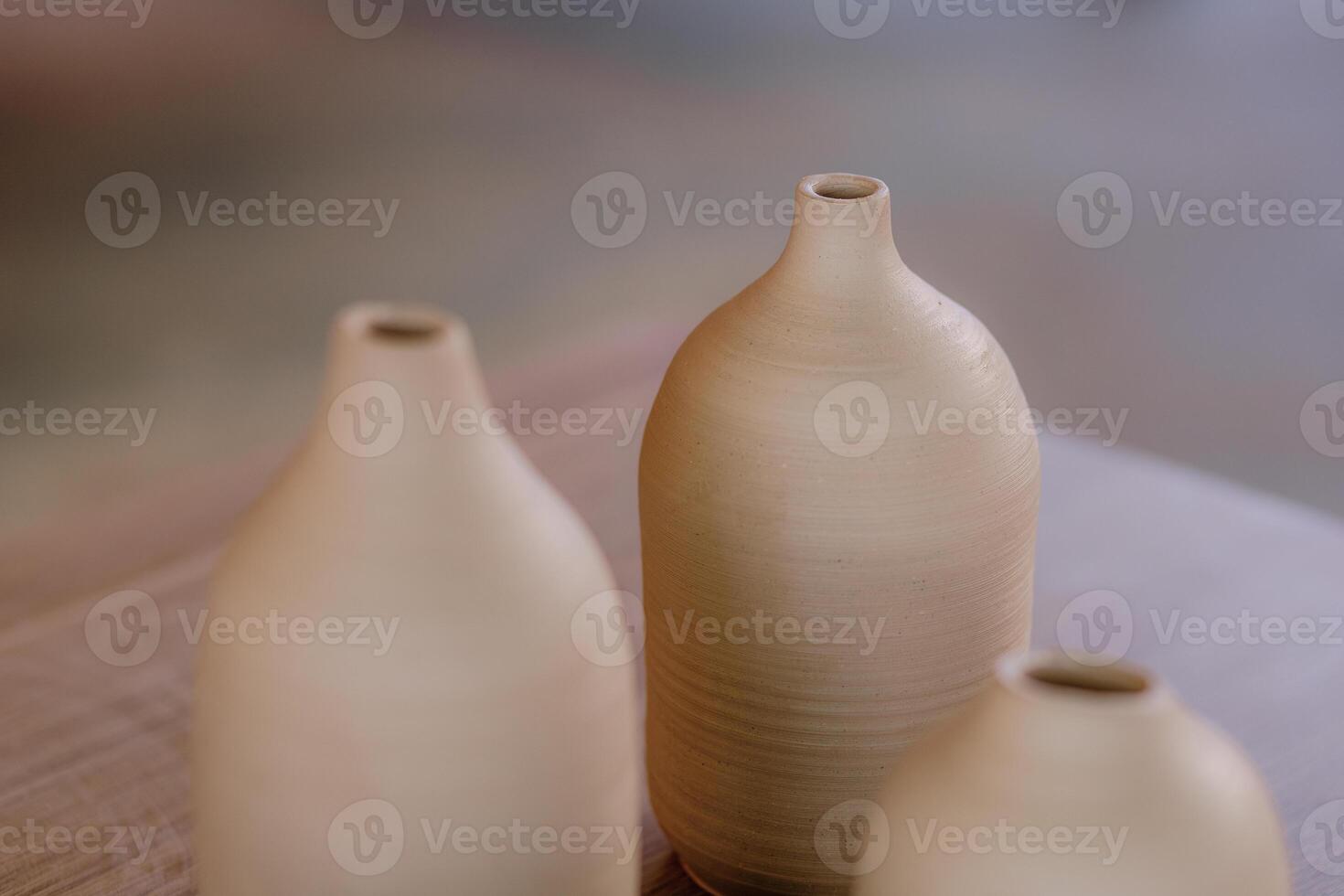 Three vases on a table photo