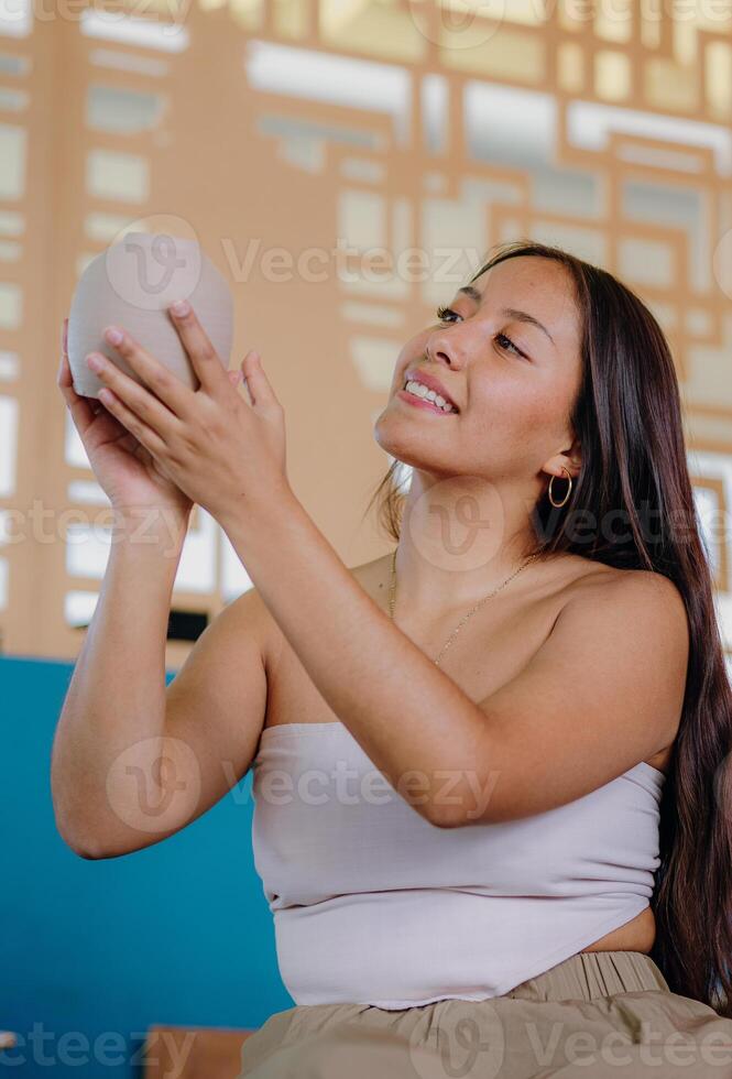 A woman holding a white ball in her hand photo