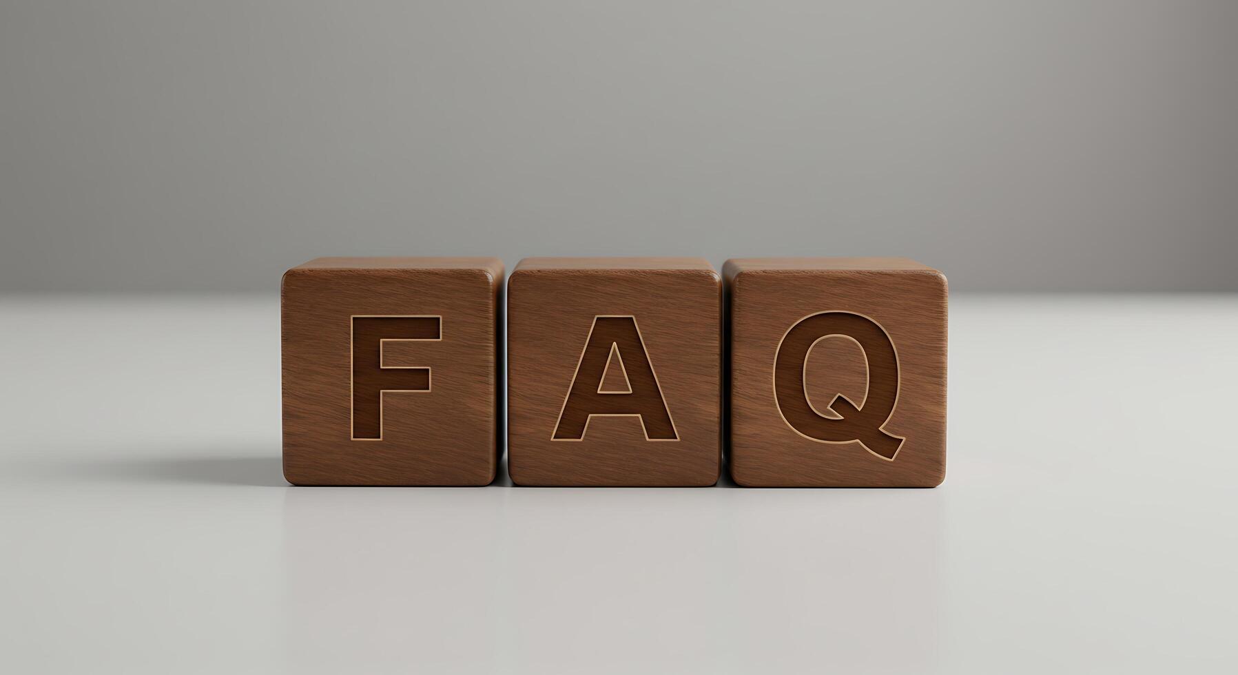 Wooden Blocks Spell FAQ, Displayed on a Reflective White Surface photo