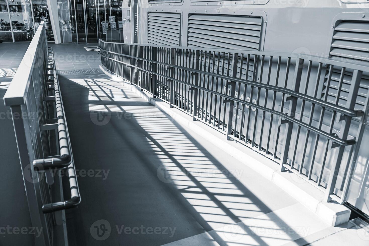 Public ramp, Handicap wheelchair people pass way with safety dot mark for disability in modern city photo