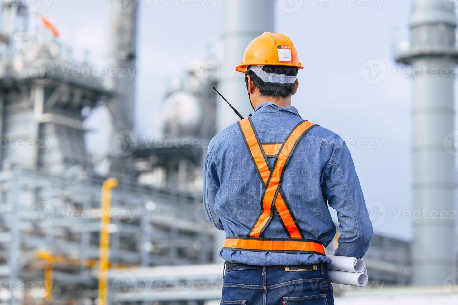 Professional Petroleum Refinery engineer male working building oil and gas power industrial plant. photo