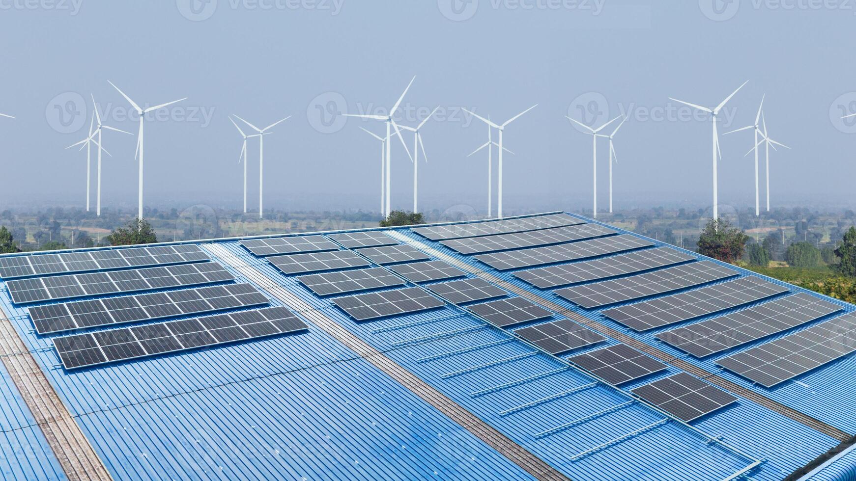 Modern factory using solar cell and wind turbine clean power source for saving energy and low carbon photo