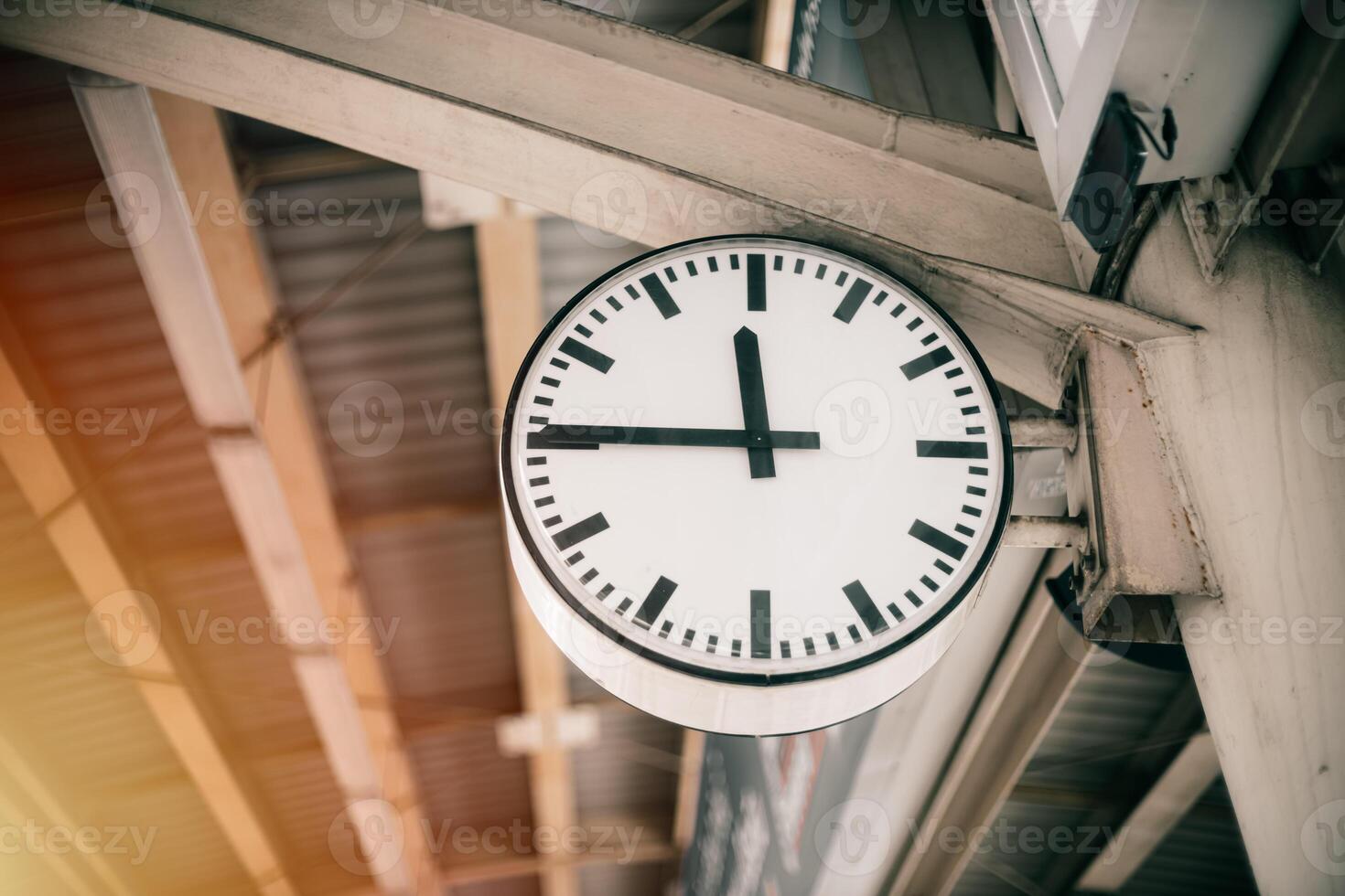 Time clock at train station platform, business people go working at rush hours in city urban metro photo