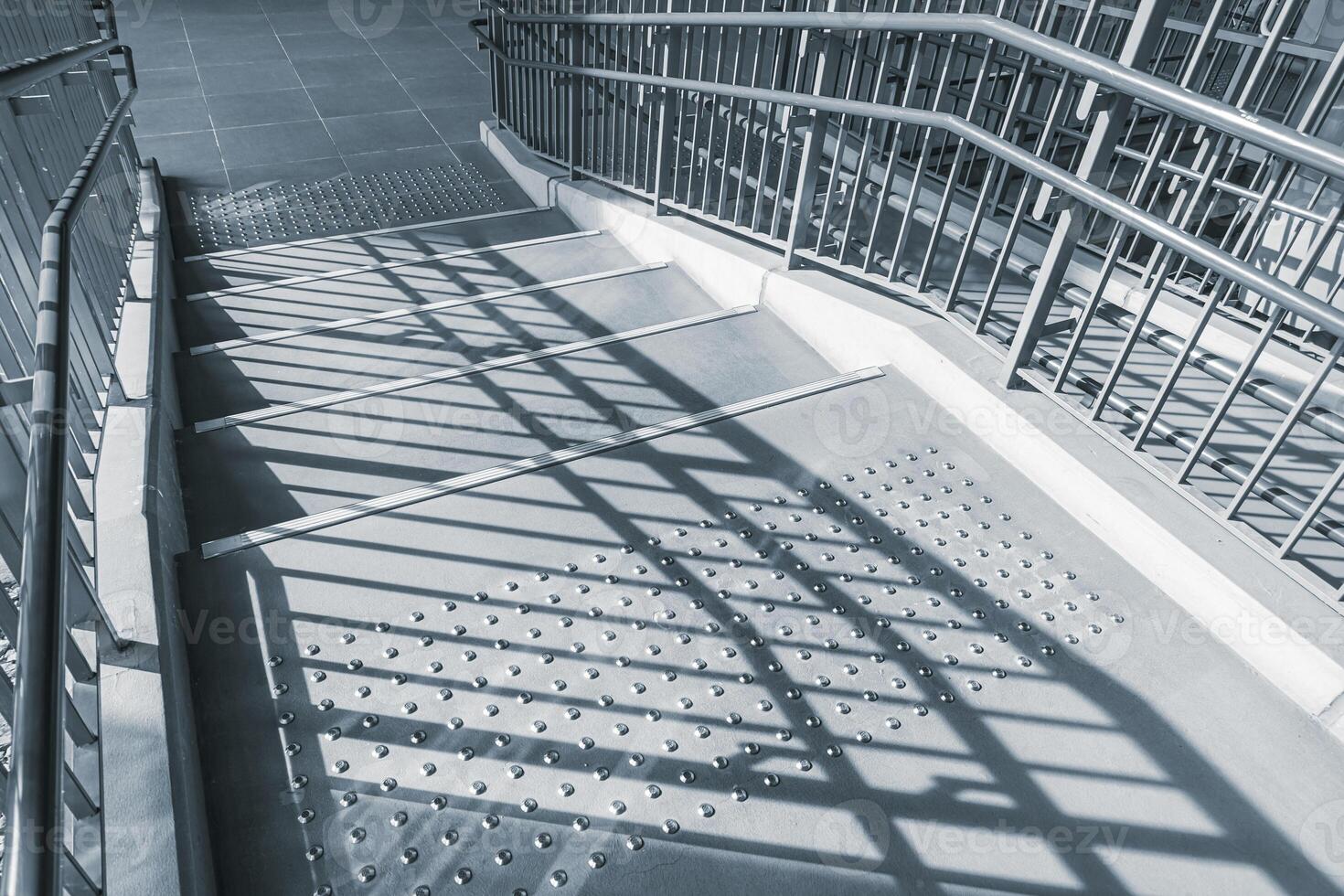 Public stairs and ramp, stair way with step safety dot mark for disability in modern city photo