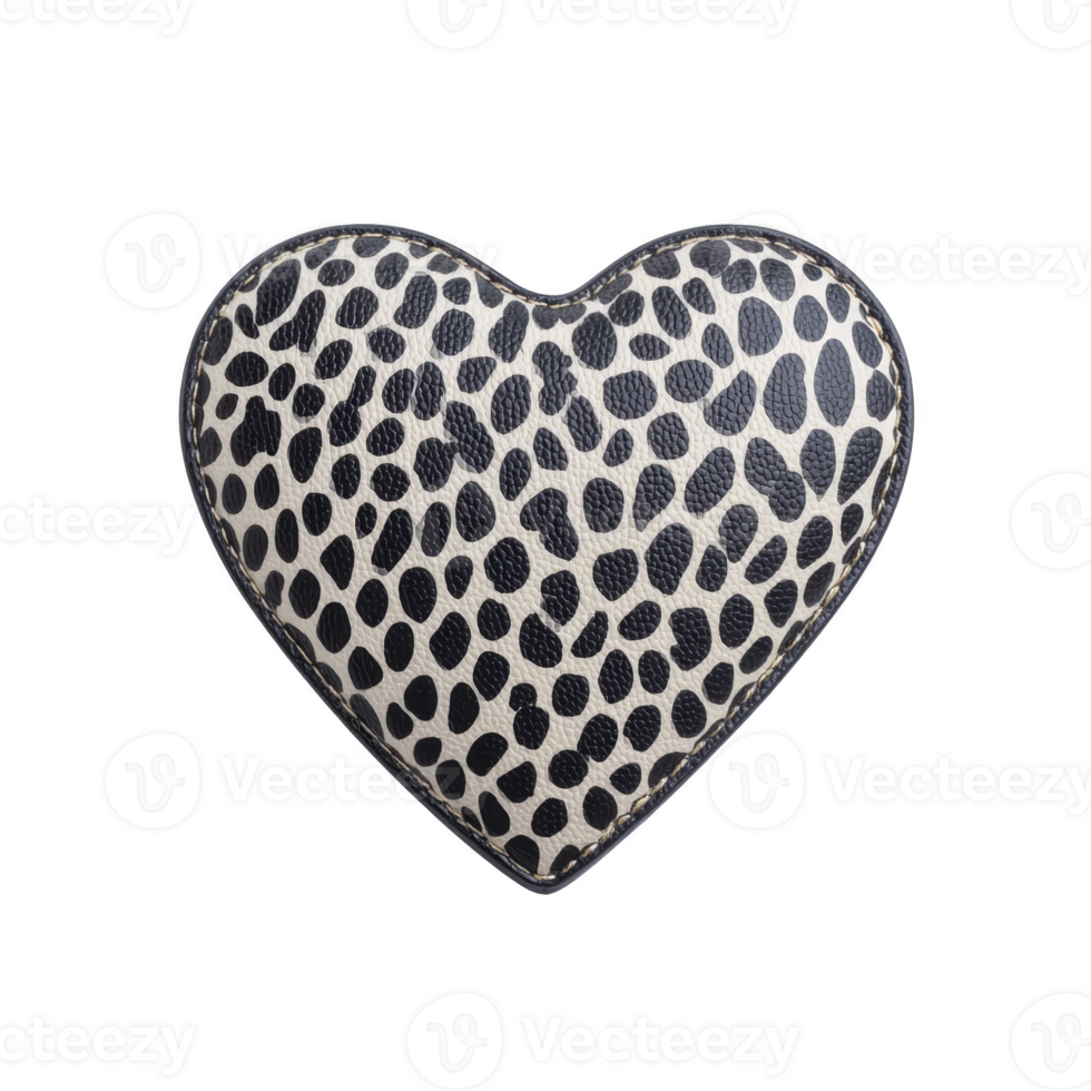 Heart shaped pillow with black and white spotted pattern, resembling animal print, is displayed against plain background. design is bold and stylish png