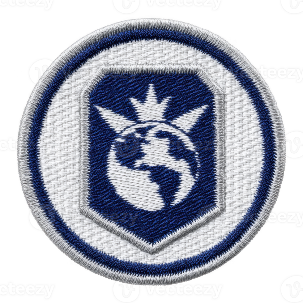 This features round embroidered patch with globe design and crown like symbol top, set against blue background with white border. patch conveys sense of global unity or leadership.globe design png