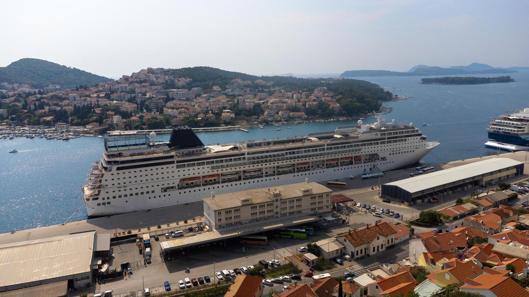 Dubrovnik, Croatia, 08-28-2024, Aerial view of a cruise ship docked at the shore in Dubrovnik port. Dalmatia, Croatia, travel and transportation industry photo