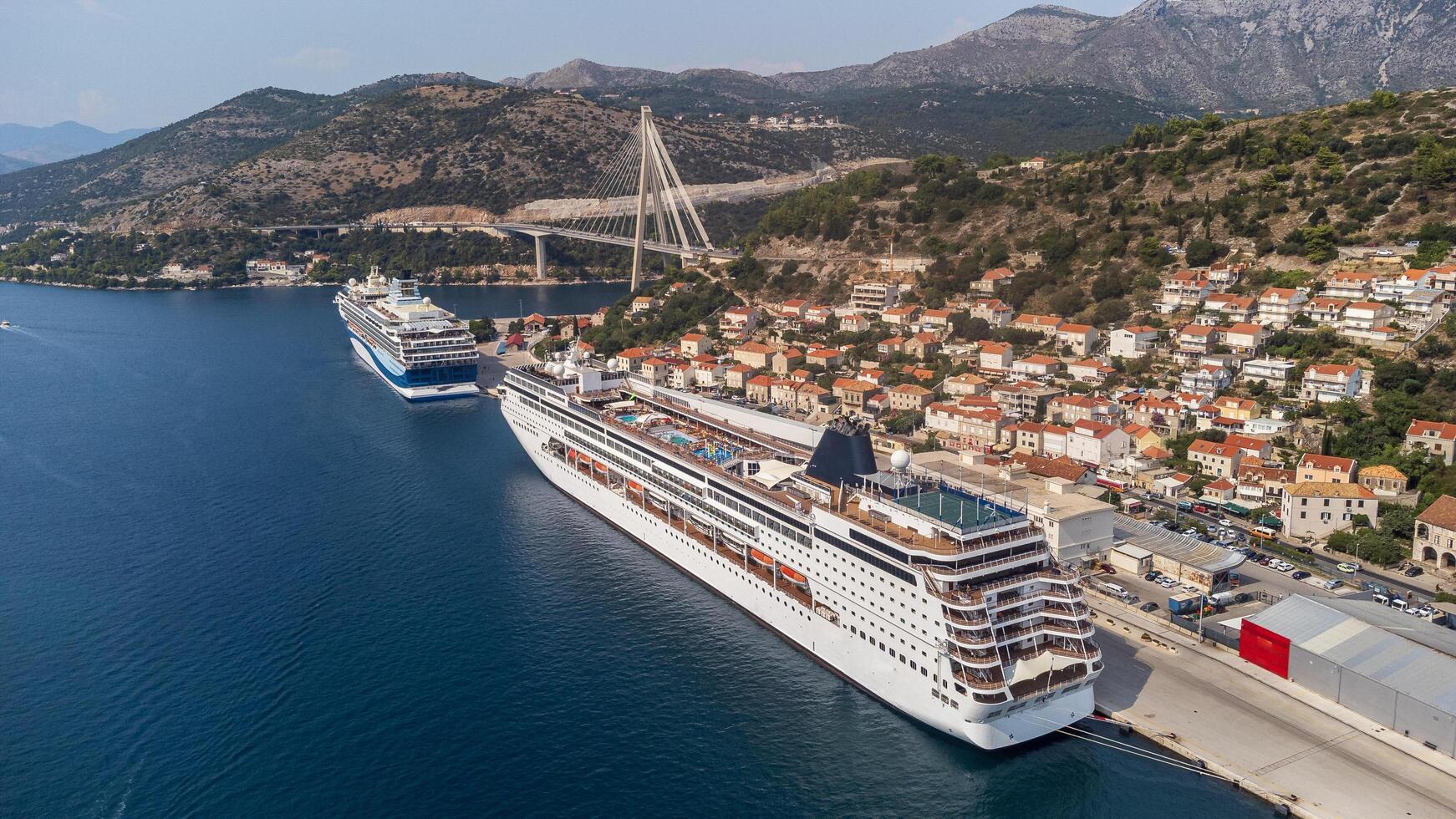 Dubrovnik, Croatia, 08-28-2024, Aerial view of a two cruise ships docked at the shore in Dubrovnik port. Dalmatia, Croatia, travel and transportation industry photo