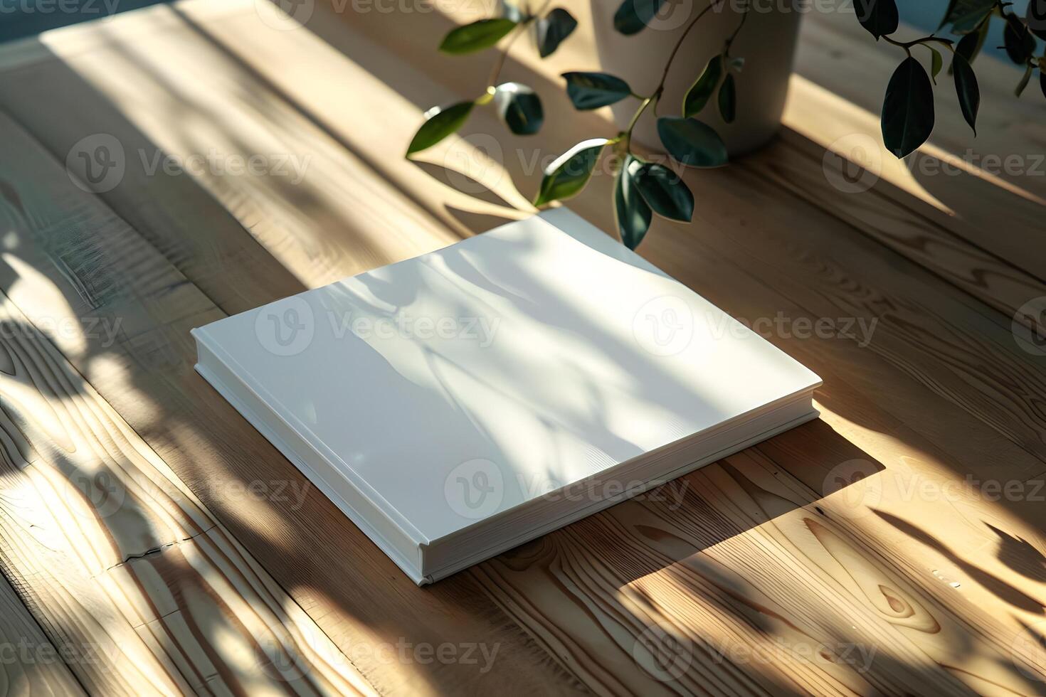 Sunlight Illuminates Blank Book Resting on Wooden Table, Evoking Serenity and Creativity, Perfect for Design Inspiration and Artistic Projects. photo