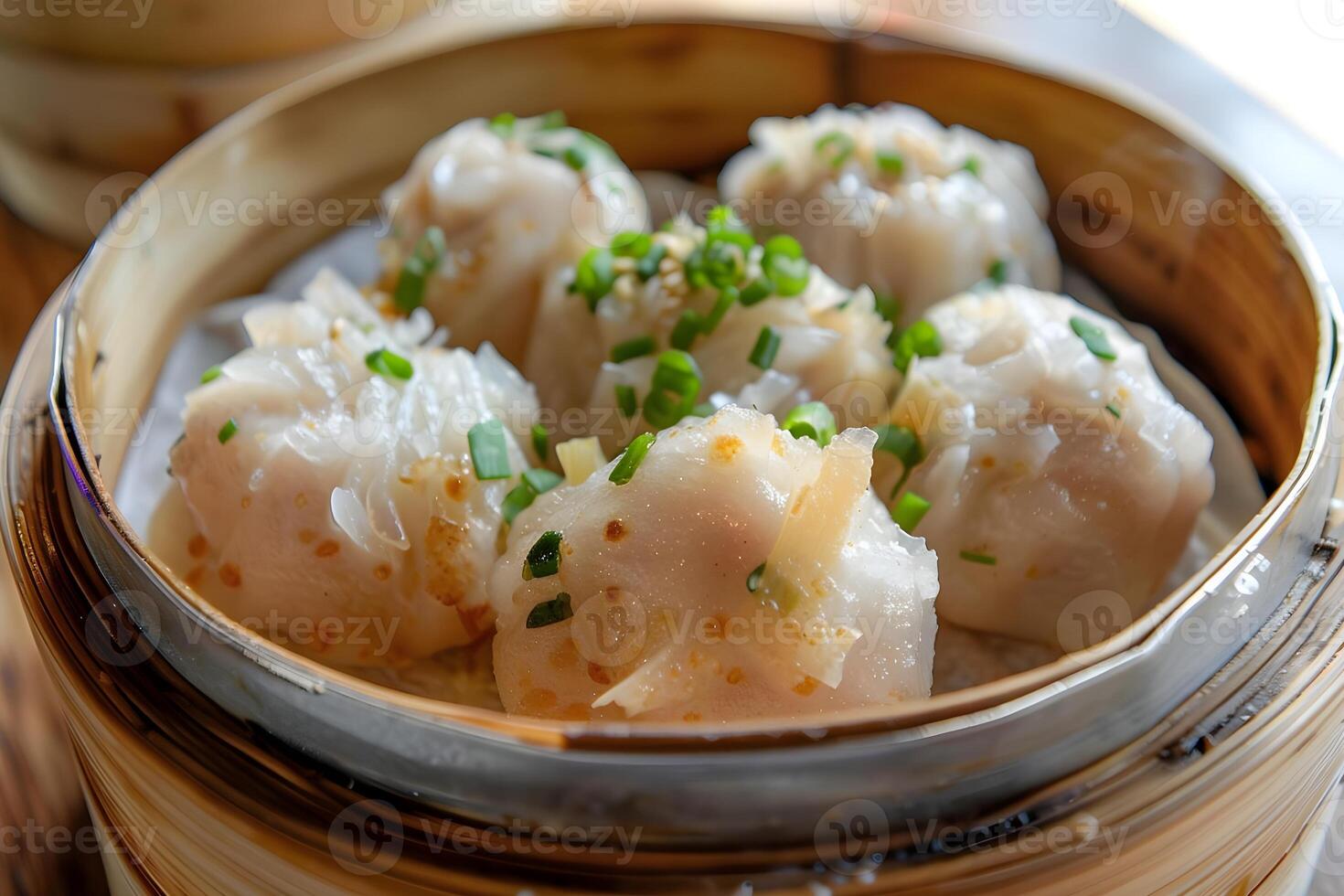 Scrumptious Steamed Dumplings A Culinary Delight of Fluffy Textures and Savory Flavors, Garnished with Fresh Herbs, Served in a Traditional Bamboo Steamer. photo
