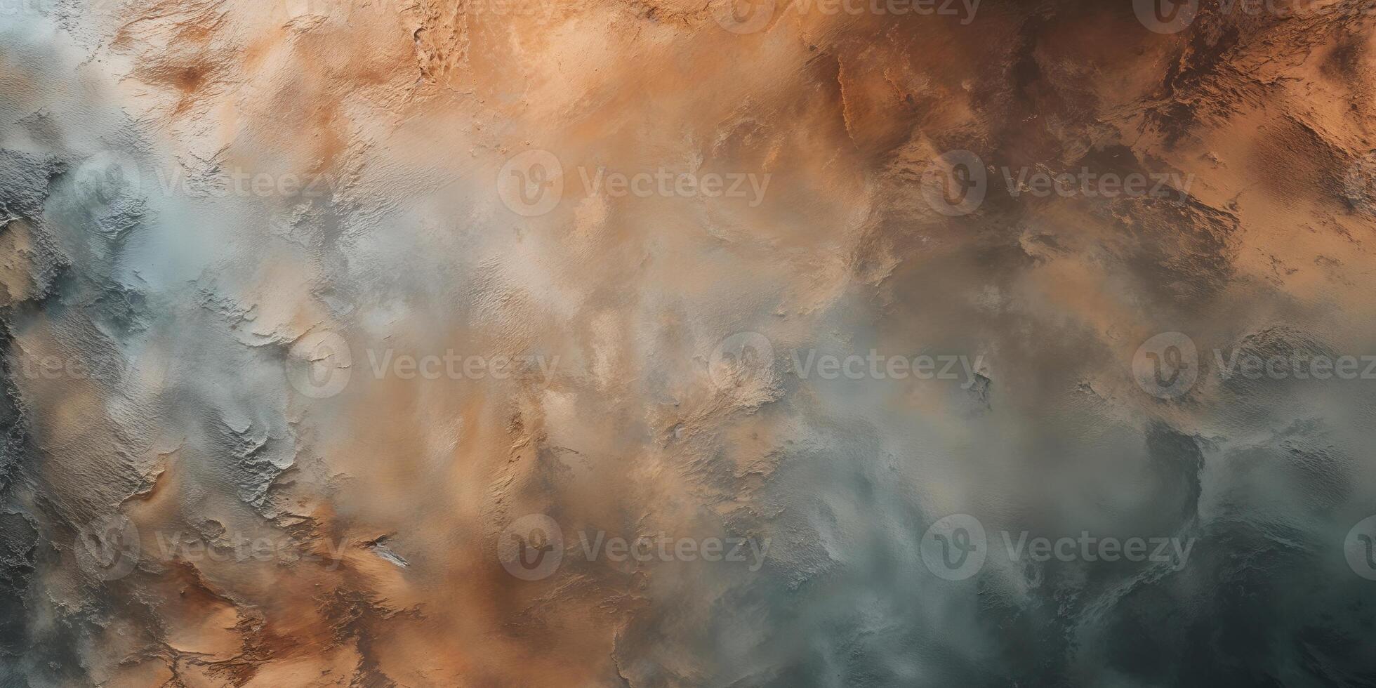 A painting of a mountain with orange, blue and brown colors photo
